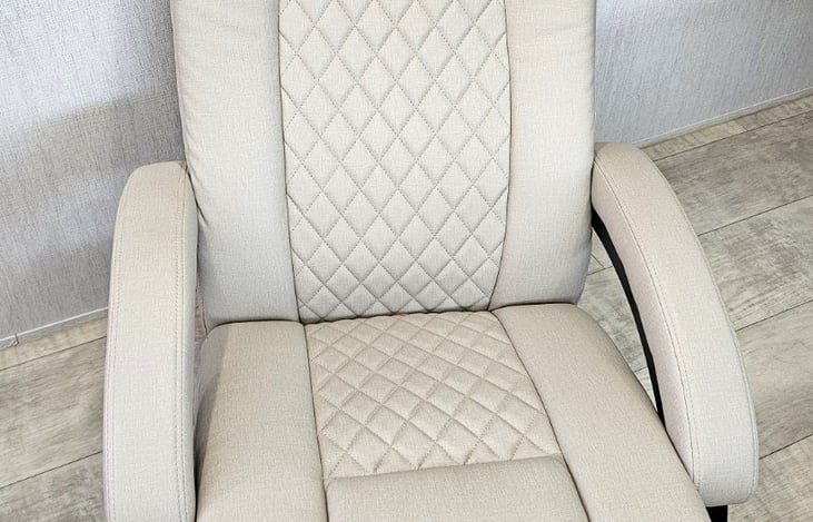 Comfortable reclining chair with quilted upholstery