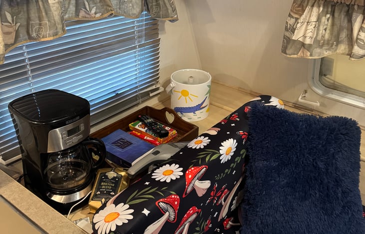 Coffee nook with dvd player remote, card games, bible