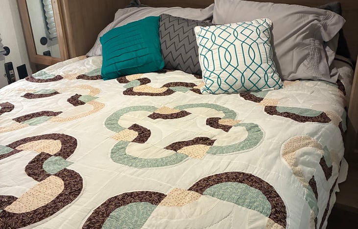 Queen bed in private bedroom with plenty storage space.