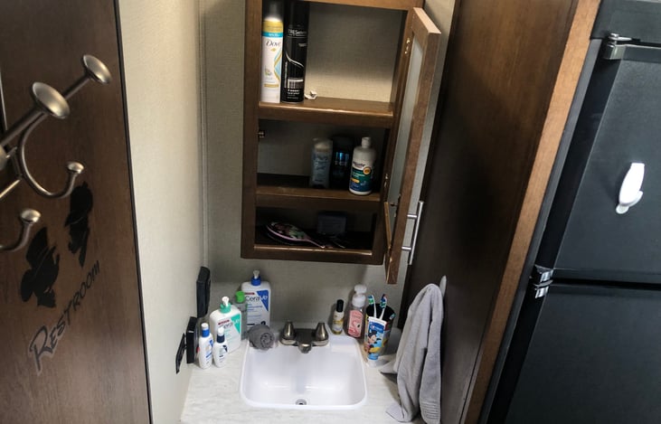 If it’s a messy bun or hat for a exploring or a few well placed curls for that street dance or church the mirror vanity can hold full sized products.