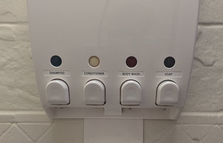 Shampoo, Leave in/No rinse Conditioner-helps to save water, Bodywash, & Soap Dispenser. 5 gal-hot water tank takes ~20ish mins to heat up. To save on water, Get wet, turn off, wash, then quick rinse.