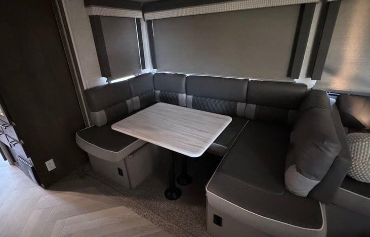 Spacious dinning room table transforms extra sleeping area