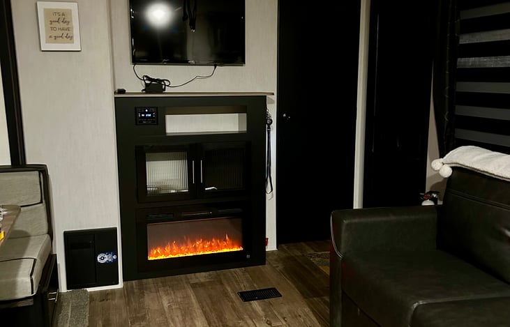 Fireplace! Blue, red, or red and blue flame options. It also puts out heat or can be just for ambiance.