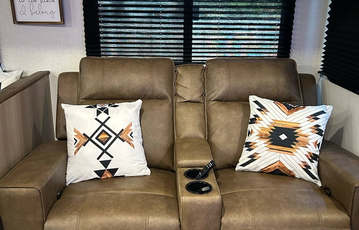 Dual theater seating recliners recline to a zero gravity position for an excellent sleeper option.