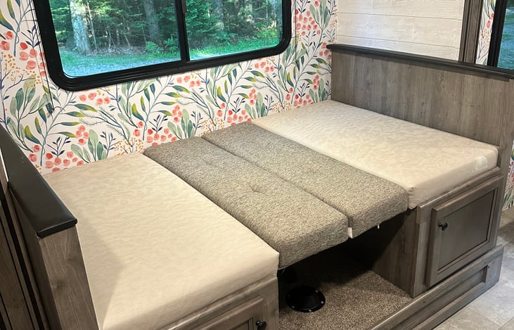 dinette converts to a bed, fits a 5'10" person comfortably