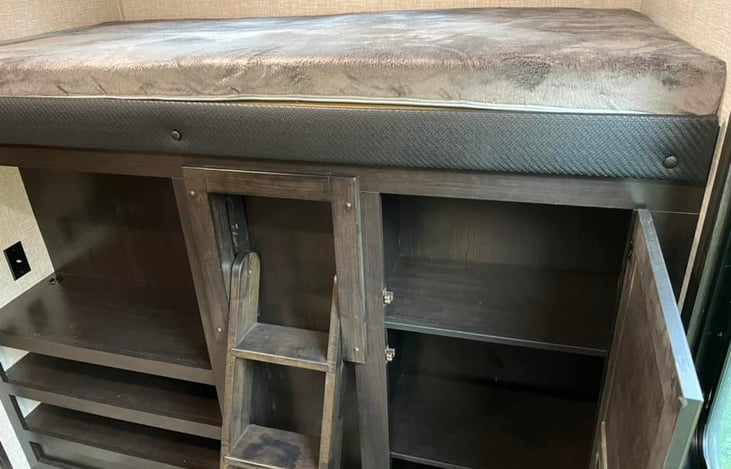 Top bunk over storage.