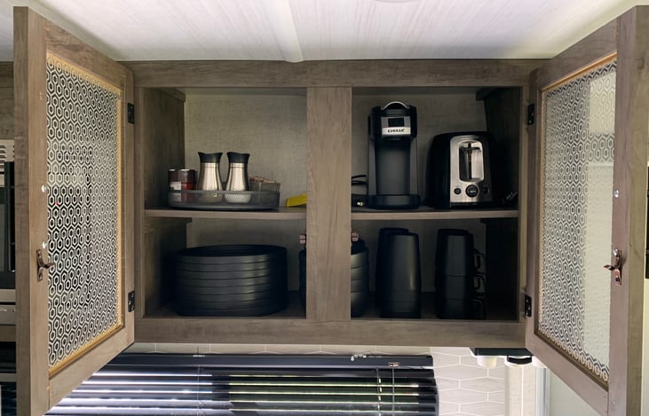 Includes setting for 8 people, 2 slice toaster, and K-cup coffee maker.