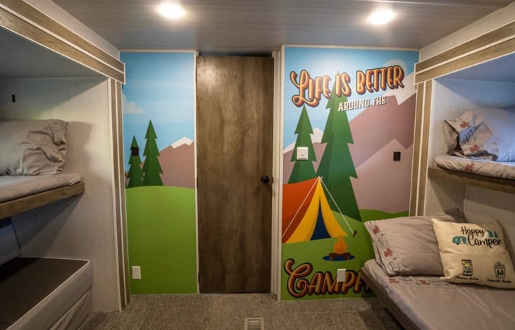 bunk room with 2 twins, full, and queen/couch bed