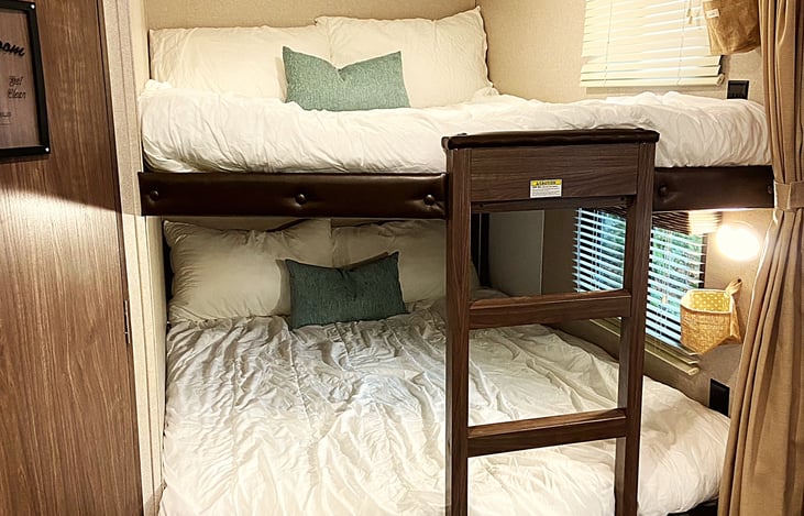 Bunks are both "double" size, and have their own window, light, plug (110v) and a curtain that closes them off together for privacy.