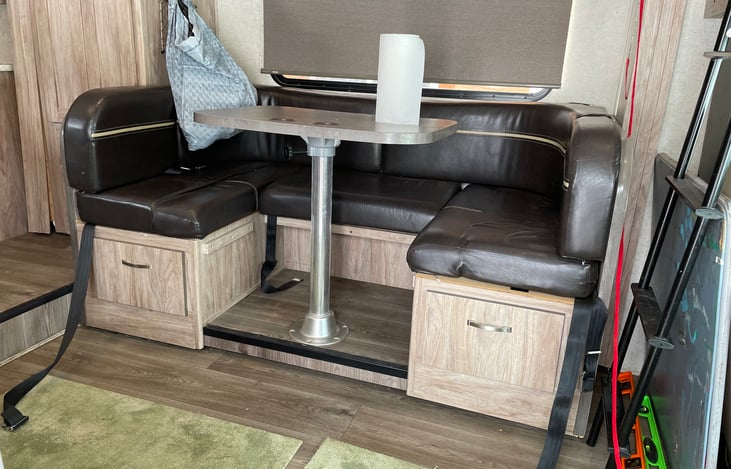 Dinette which converts to a bed as needed.