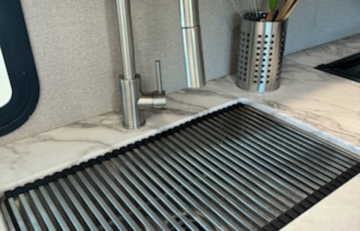 Stainless sink with top drain mat, adds more counter space!