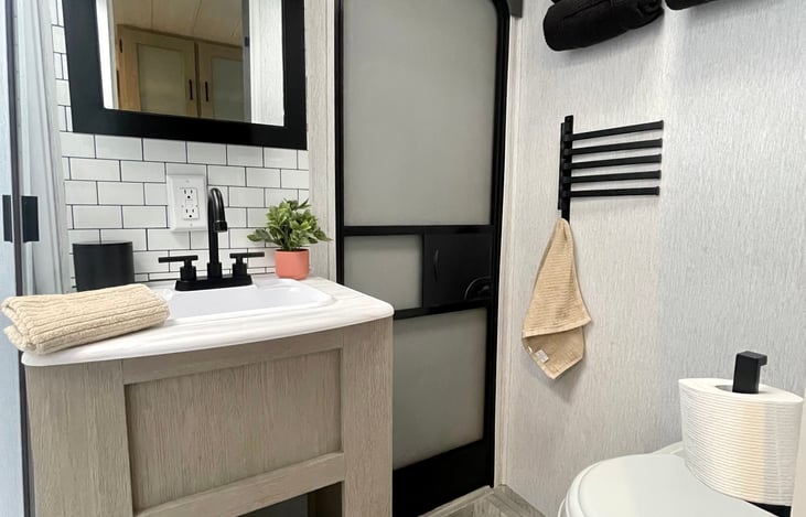 Bathroom includes sink, toilet, and shower!