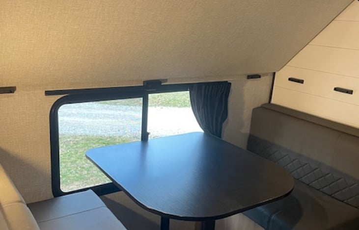 Bunk room table with bed put in upper position