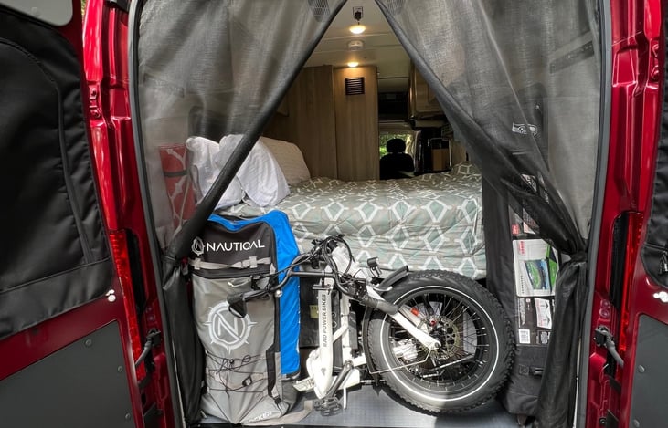 Gear Garage with tiedown rails and anchor system. Items inside the Gear Garage (Murphy bed open) in this photo are inflatable SUPboard, RadPower Expand5 e-bike, and a 12" shade tent.