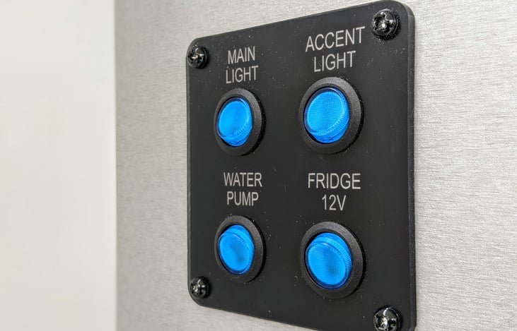 The Intech Luna Rover teardrop trailer offers switches in the kitchen for the sink, the fridge, and lots of lighting options!