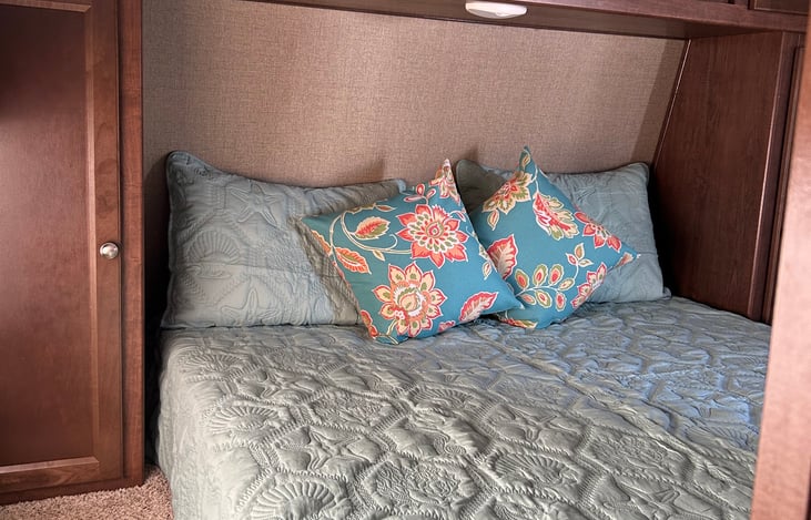 A comfy queen size Posturepedic bed. (sheets and pillows are available for a $30 per bed fee)