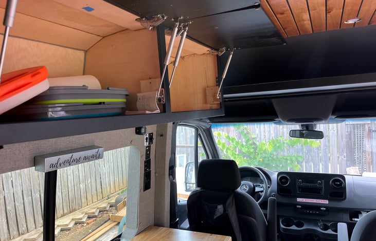 Storage over sink as well as over driver's compartment