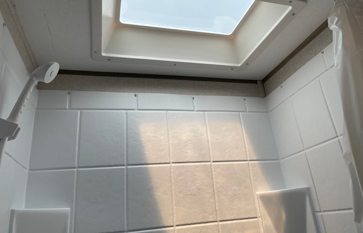 Shower tall enough for someone 6 foot tall.