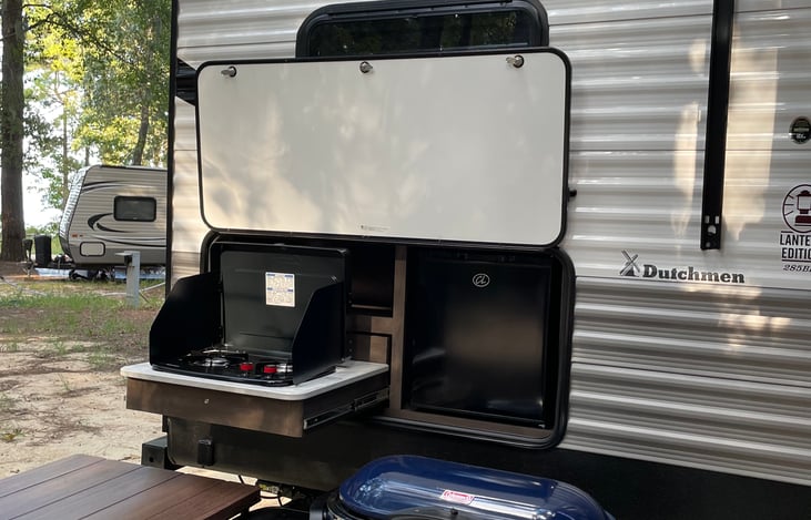 Convenient outdoor propane grill and mini fridge