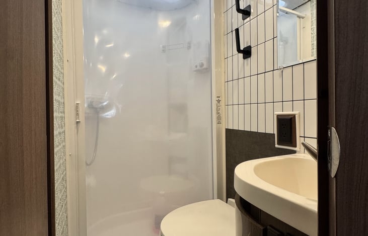 The full dry bath has a shower with extendable shower head, stocked with shampoo, conditioner and body wash. We provide tank treatment and storage under the sink, as well as a full medicine cabinet.