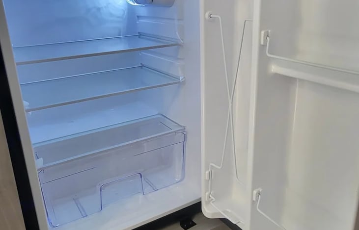 Refrigerator with small freezer