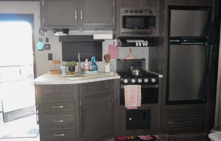 Full Kitchen with Microwave, oven and 3 burner stove.