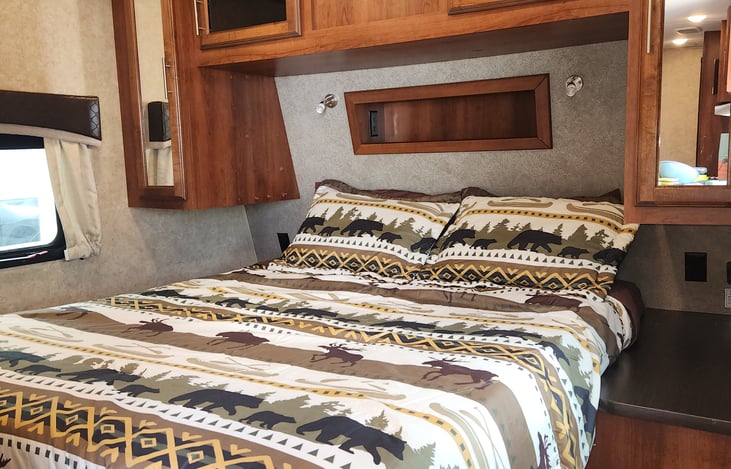 Cozy queen sized bed in private room.