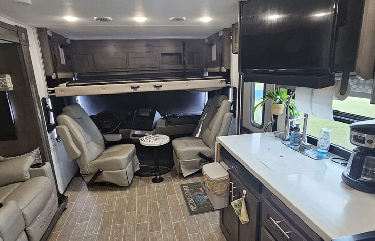 Full Size bunk pulls down from over driver/passenger seats.