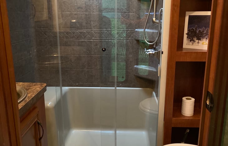 Full Bathroom, Glass Sit Down Shower, Vanity, Toilet.
(Staged Photo)