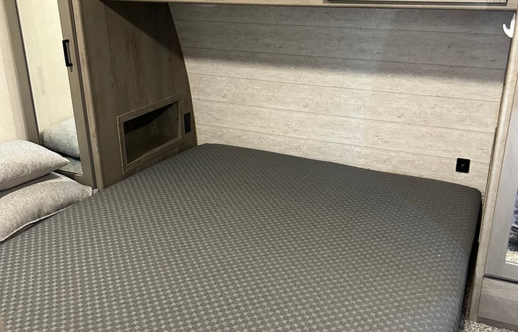 Cozy private bedroom with Queen bed. Ample storage and even a pet kennel is built in.