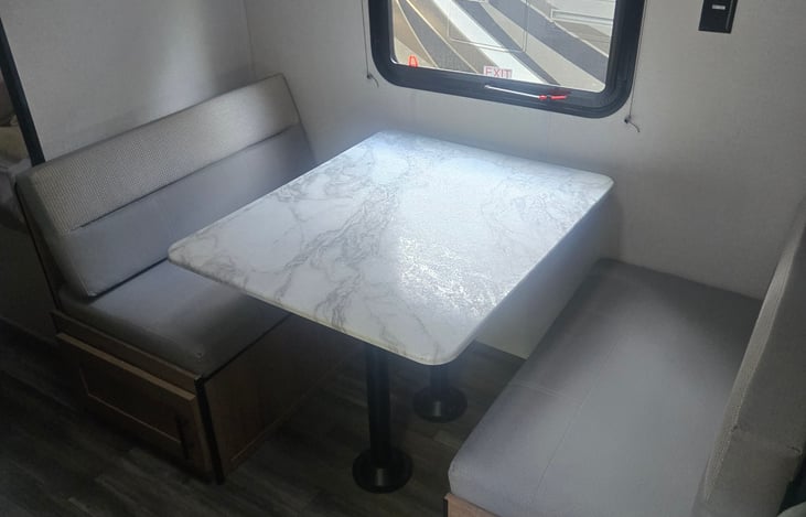 Dinette table which converts into bed