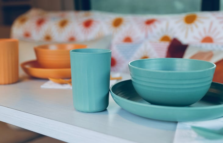 Kitchenette includes 4 sets of cups, bowls, plates, and utensils - plus cookware, and cooking utensils