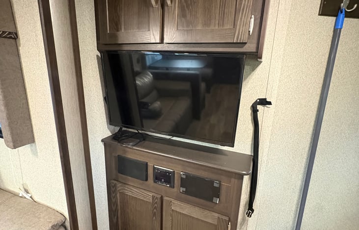 It's not a smart TV, so if you wish to watch anything id bring the Roko or Xbox. Also, the shelf below has board games for the family and friends.