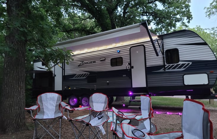 Nice exterior,  awning, outdoor kitchen and double doors for entry. Chairs and lights available for your use.
Come and relax with us!!!