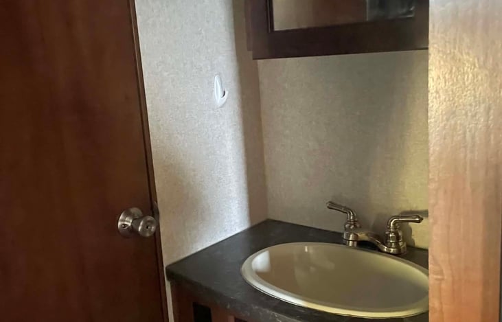 Bathroom sink right outside bath