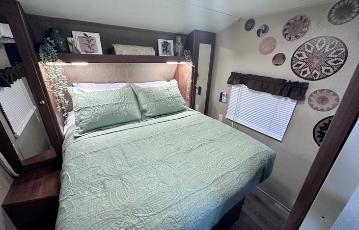 Private master bedroom with a queen pillow top mattress with outlets, storage and a mini split air conditioner