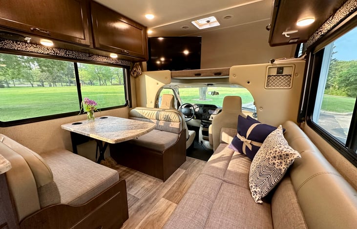 Front Living Space with Dinette and Sofa, and Seatbelts for 6 People (including the 2 in the cab)