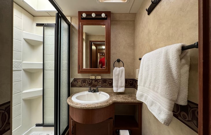 Bathroom includes stand up shower and toilet.