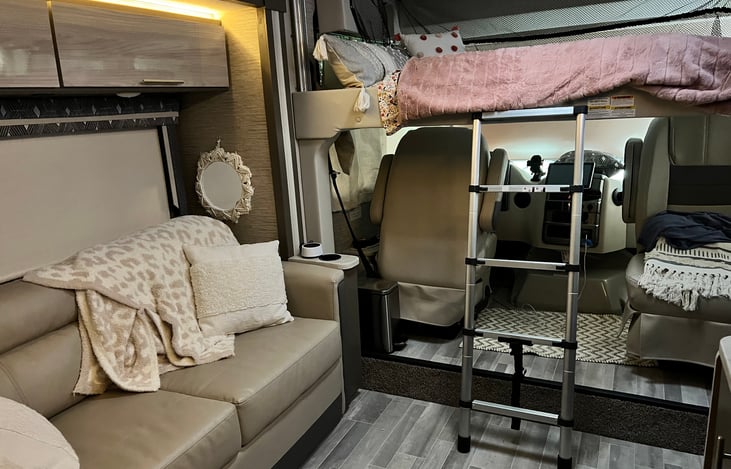 Bunk twin bed above or pull the couch out below for a full bed.