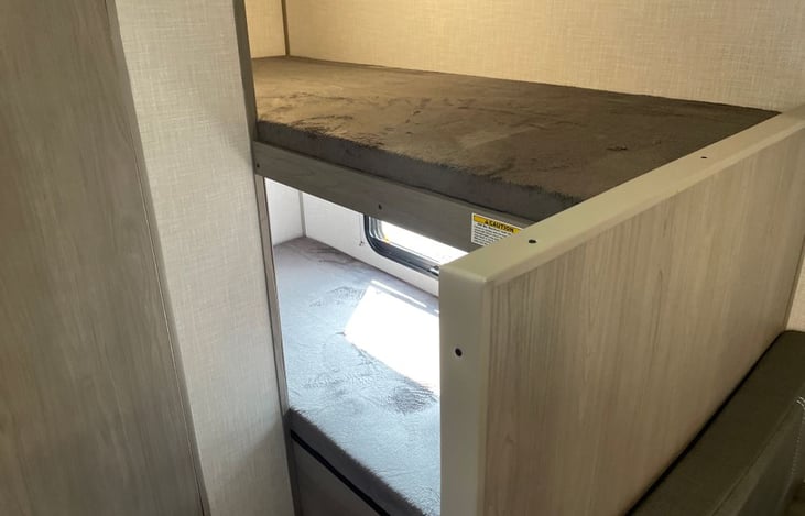 72" bunks in the rear of the camper have a 300 lb weight limit