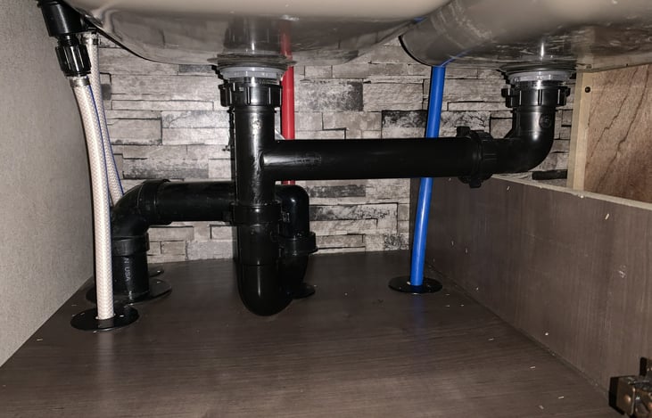 top shelf under the sink for storage.