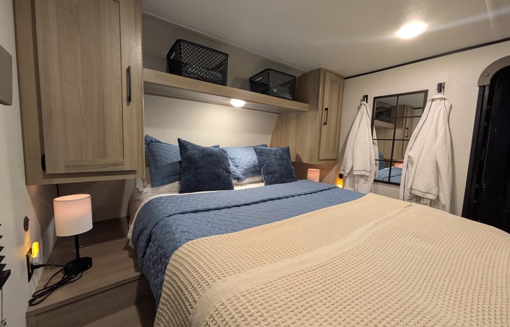 Queen size main sleeping area. USB-A and USB-C charging ports.