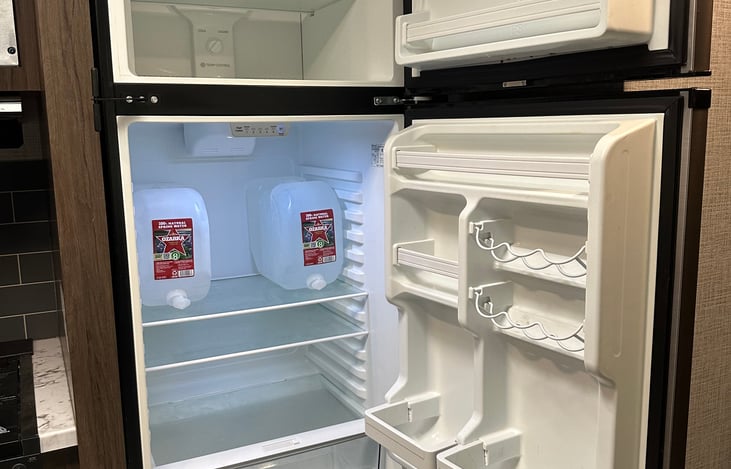 Spacious fridge (for a travel trailer) -- runs on 12V, so keeps everything cool during your trip!