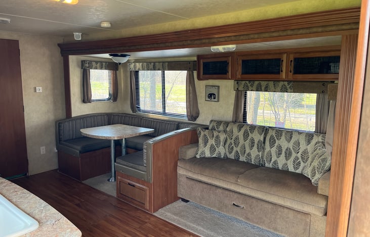 U-shaped dinette and couch slide out.