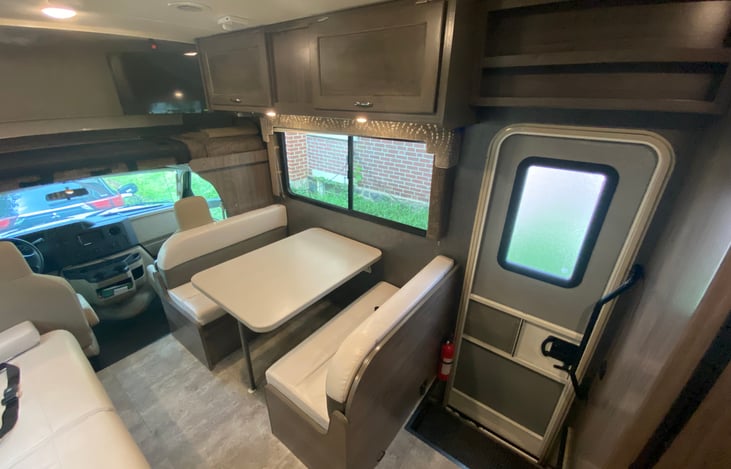 View from kitchen of side door and table.