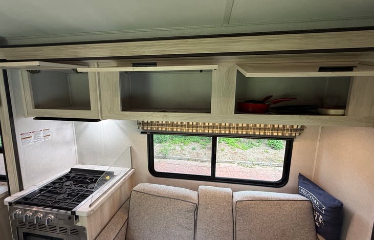 Ample storage for food and kitchen items. We provide a few pots for cooking on the stove and a few plates that Darla used when she was a kid.