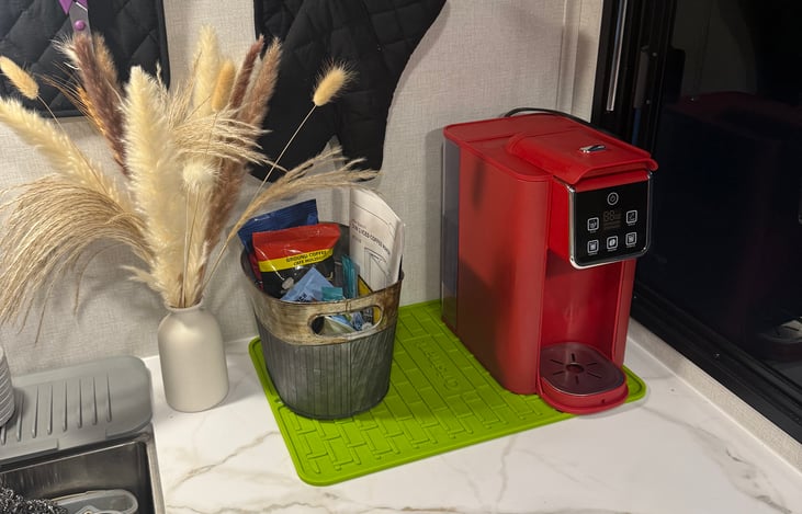 individual pod coffee maker, some coffee & tea provided
