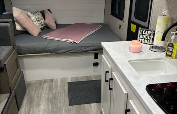 Queen bed with curtain to divide spaces