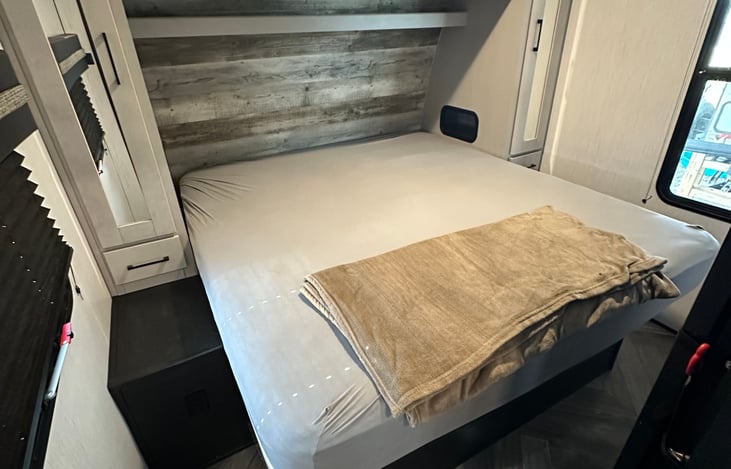 Master bed in the front of the camper. Two small closets on each side of bed.