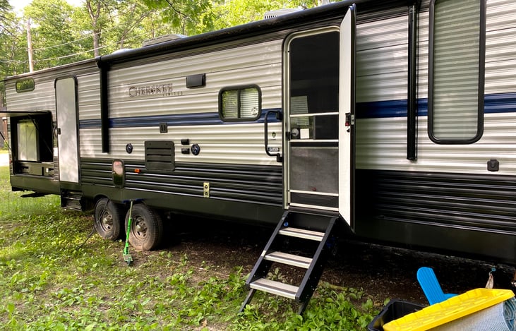 Stable entry stairs, outdoor bathroom entry and outdoor kitchen with sink, gas stove and fridge/freezer